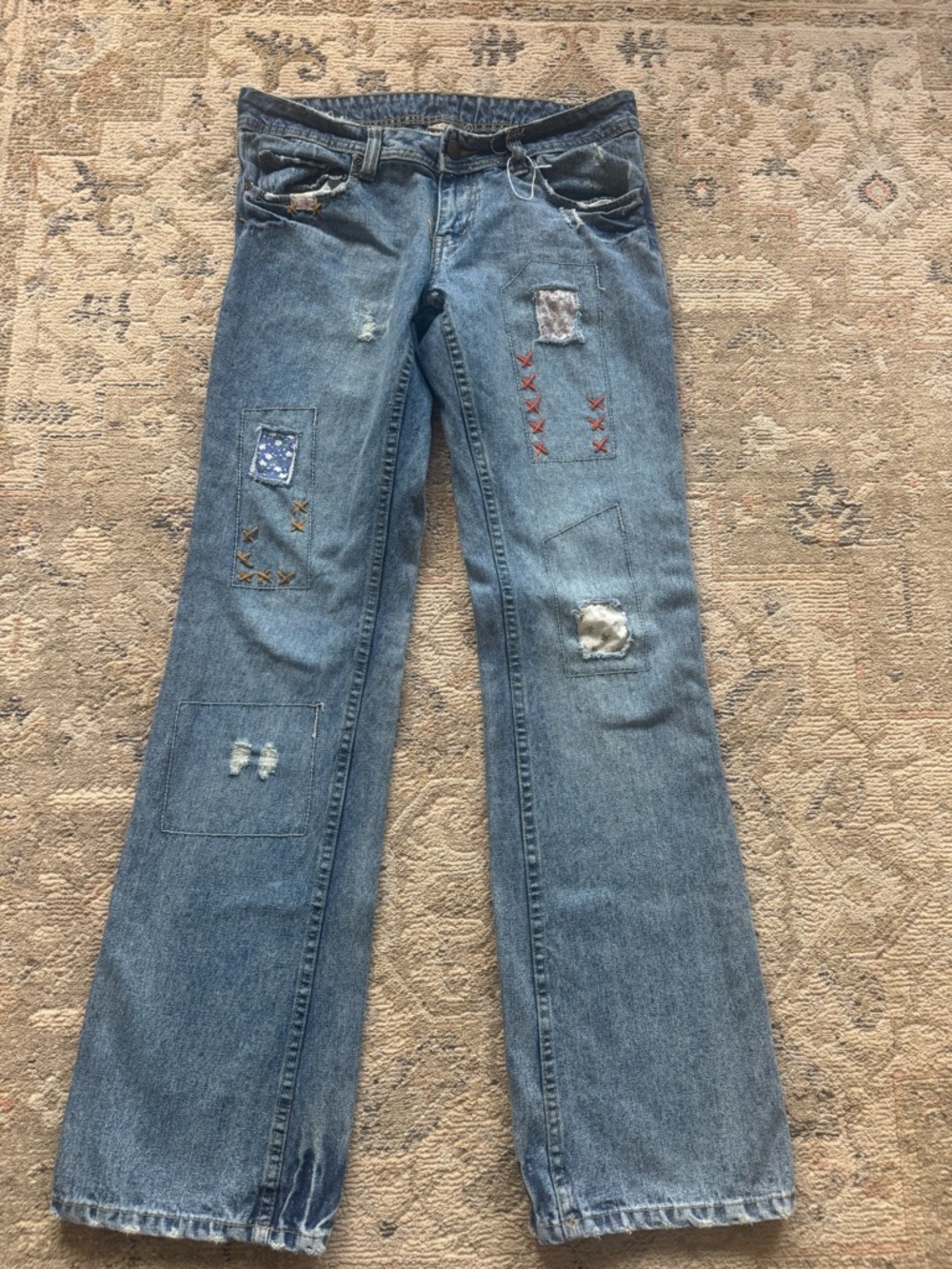 Vintage-Inspired Blue Boot Cut Jeans with Patchwork Accents